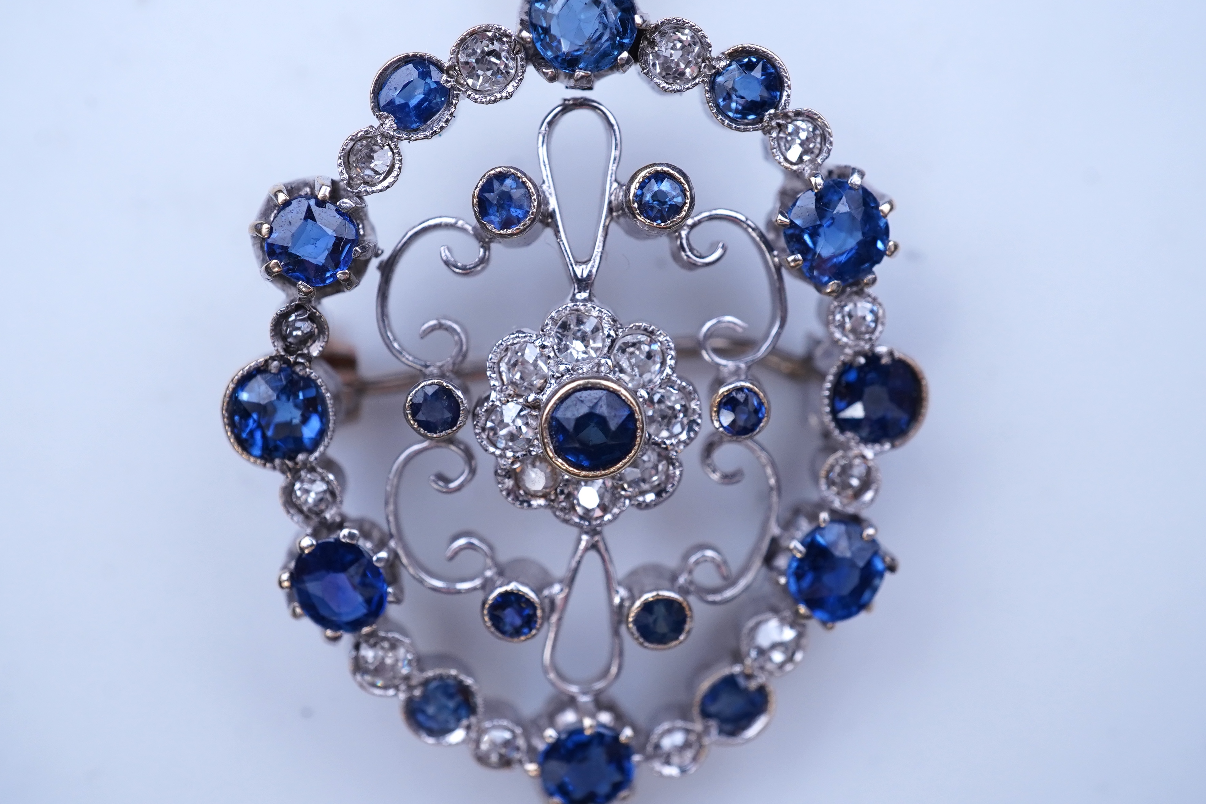 A sapphire and diamond brooch/pendant, mid 20th century